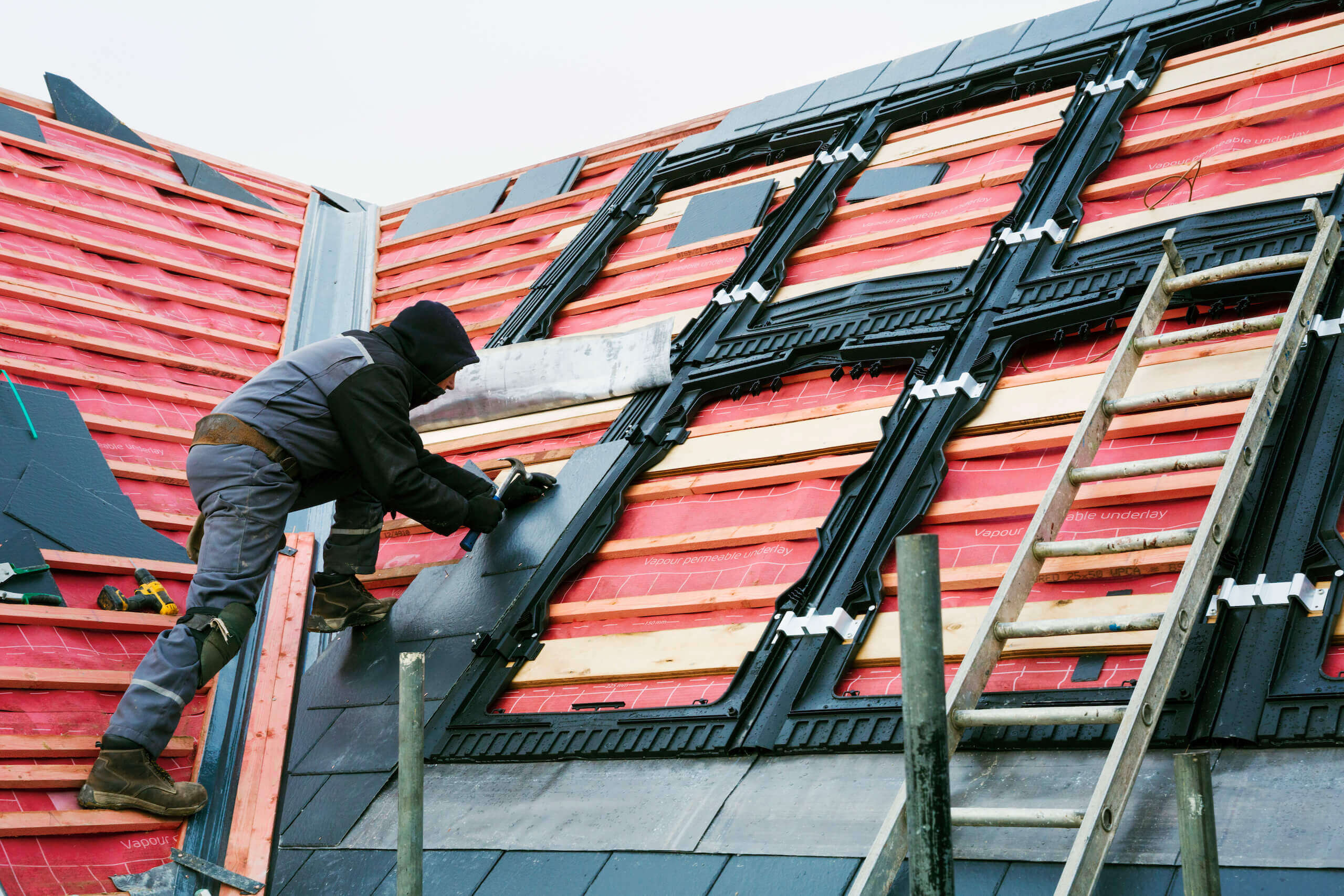 a roofer replacing the tiles on a house roof 2022 03 04 02 08 51 utc 1