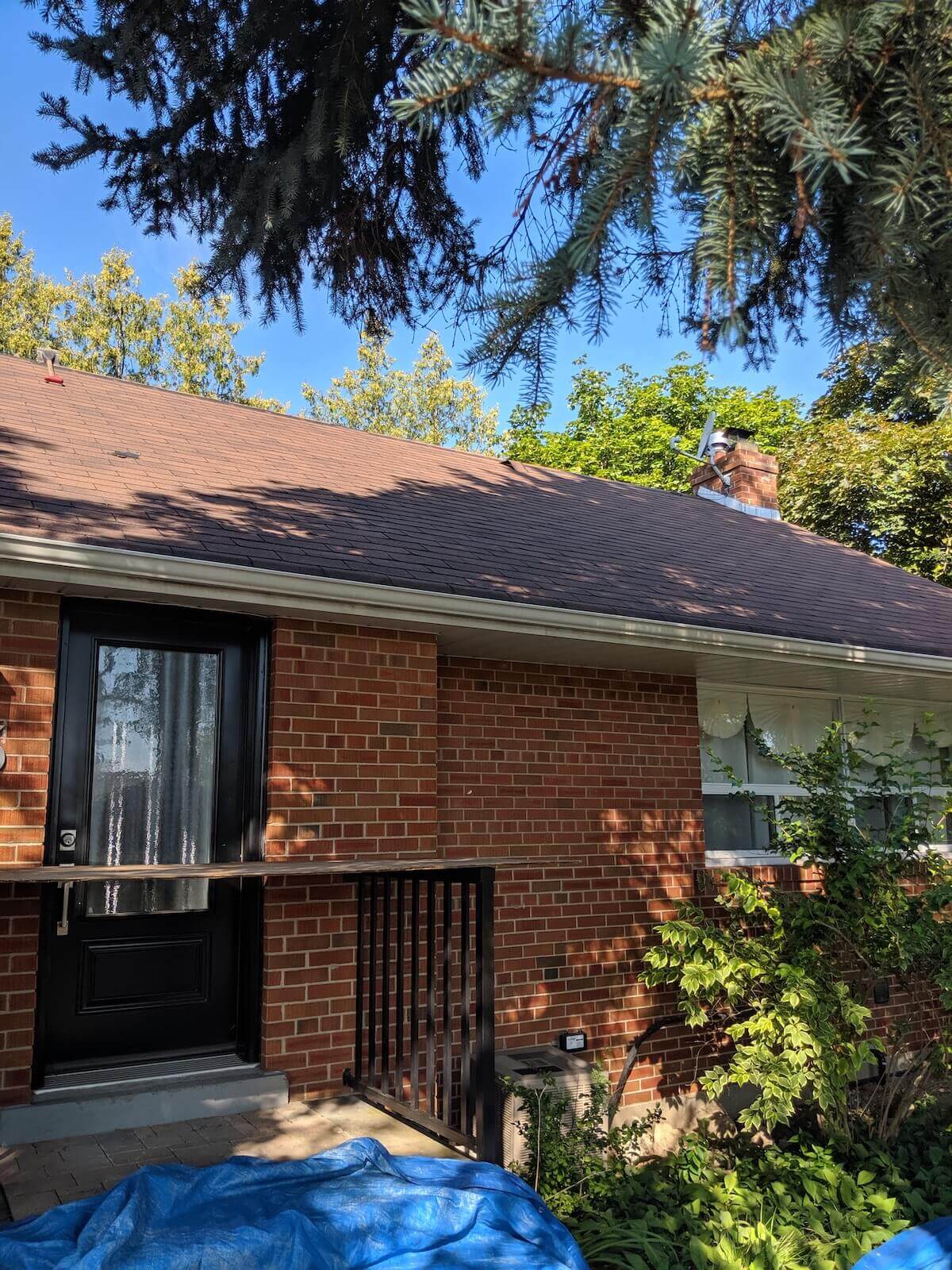 Roofing maintenance work on residential roof