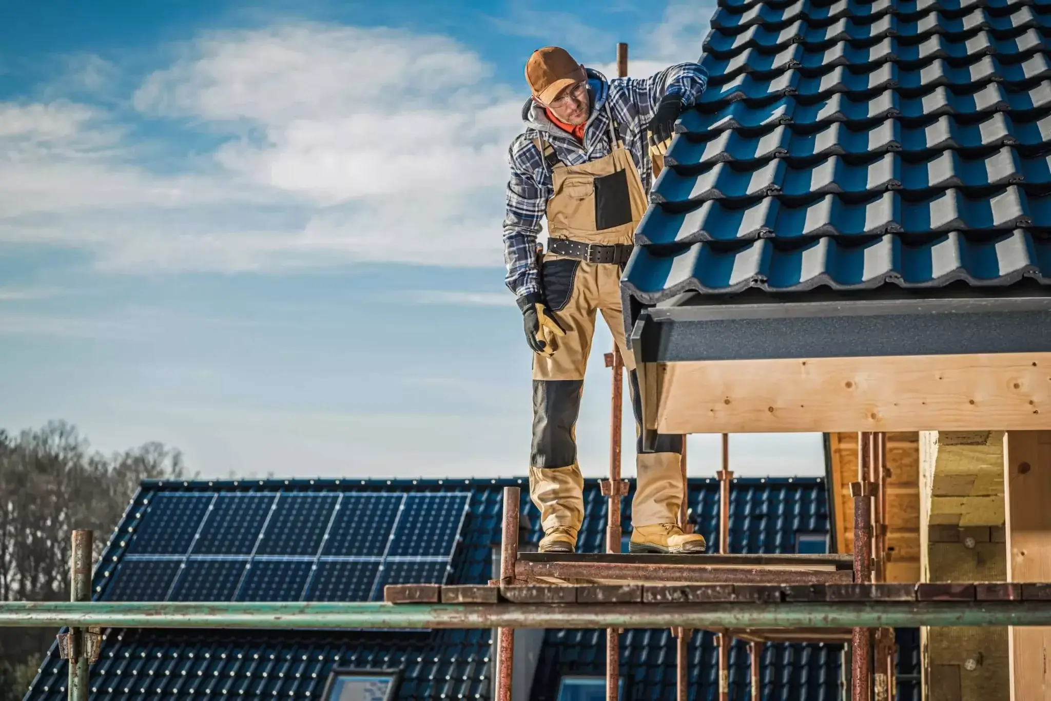Experienced roofer inspecting roof for damages in Georgetown
